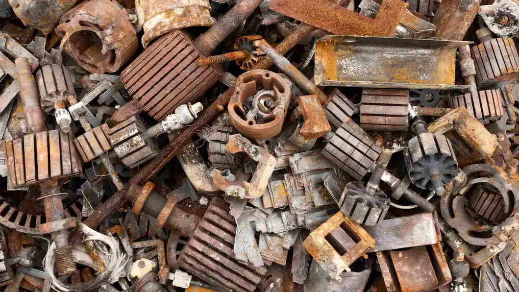 Pile of rusty iron and steel scrap metal machine parts for recycling